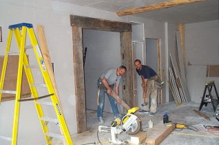 Mick & Ben setting the barn beams for the bar/pub