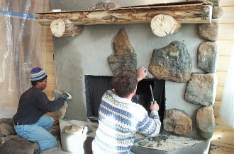 Dan and Delroy stoning the fireplace