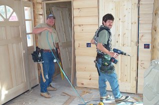 John and Sergio installing interior doors