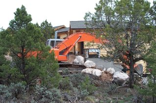 Hitachi building the retaining wall and steps