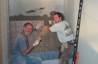 Mick & Kevin tiling the small bathroom